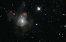 Hubble Catches Dying Galaxy In Galactic Waltz 