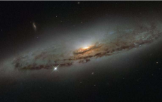 NGC 4845's Glowing Center Holds Giant Black Hole