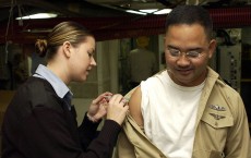 US Navy recruit receiving a vaccine