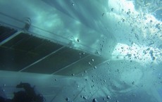 A side of the Costa Concordia cruise ship is seen underwater after it ran aground off the west coast of Italy, at Giglio island