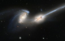 Pair Of Galaxies Engaged In A Celestial Dance Of Cat And Mouse Or In This Case Mouse