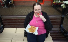 Woman eating take away chips