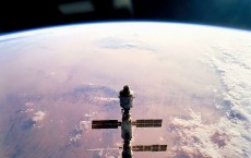 Silhouetted Over Earth The International Space Station