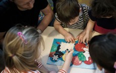 Kids playing with puzzles.