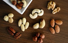 Variety of Brown Nuts on Brown Wooden Panel High-angle Photo