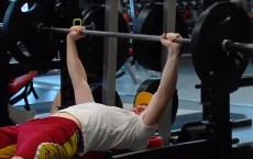 Man Bench Pressing Weights (IMAGE)