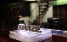 Leaving traditional casting techniques aside, the AMAZE team printed its logo in titanium as an intricate net shaped to millimetre precision.